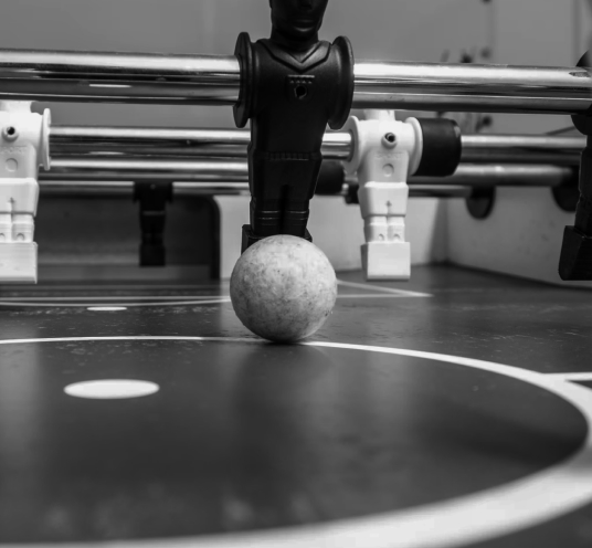 Foosball table with a ball in play